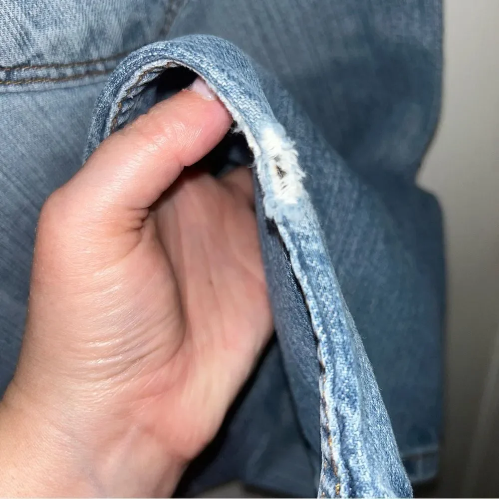 Levi’s 505 Distressed Denim Jeans